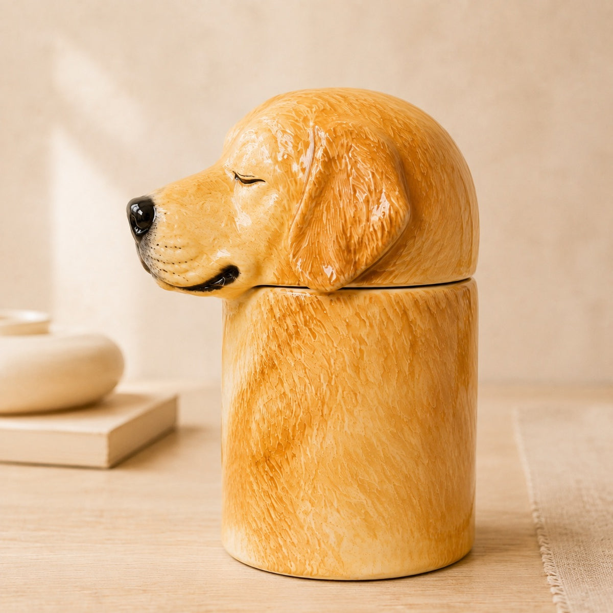 Side profile of a ceramic Golden Retriever memorial urn facing left