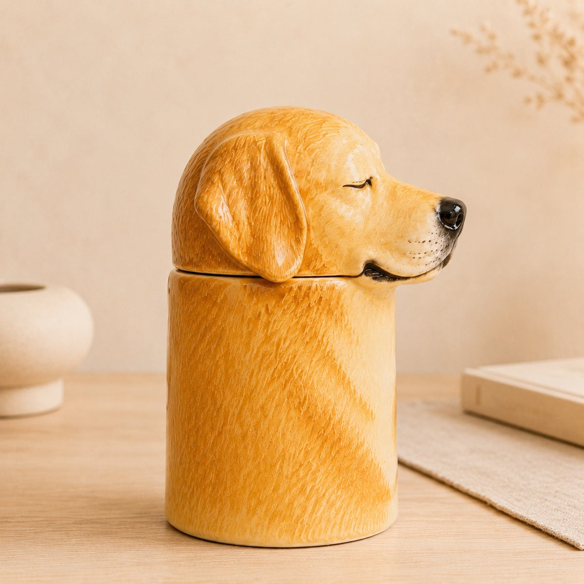 Side profile of a ceramic Golden Retriever memorial urn facing right