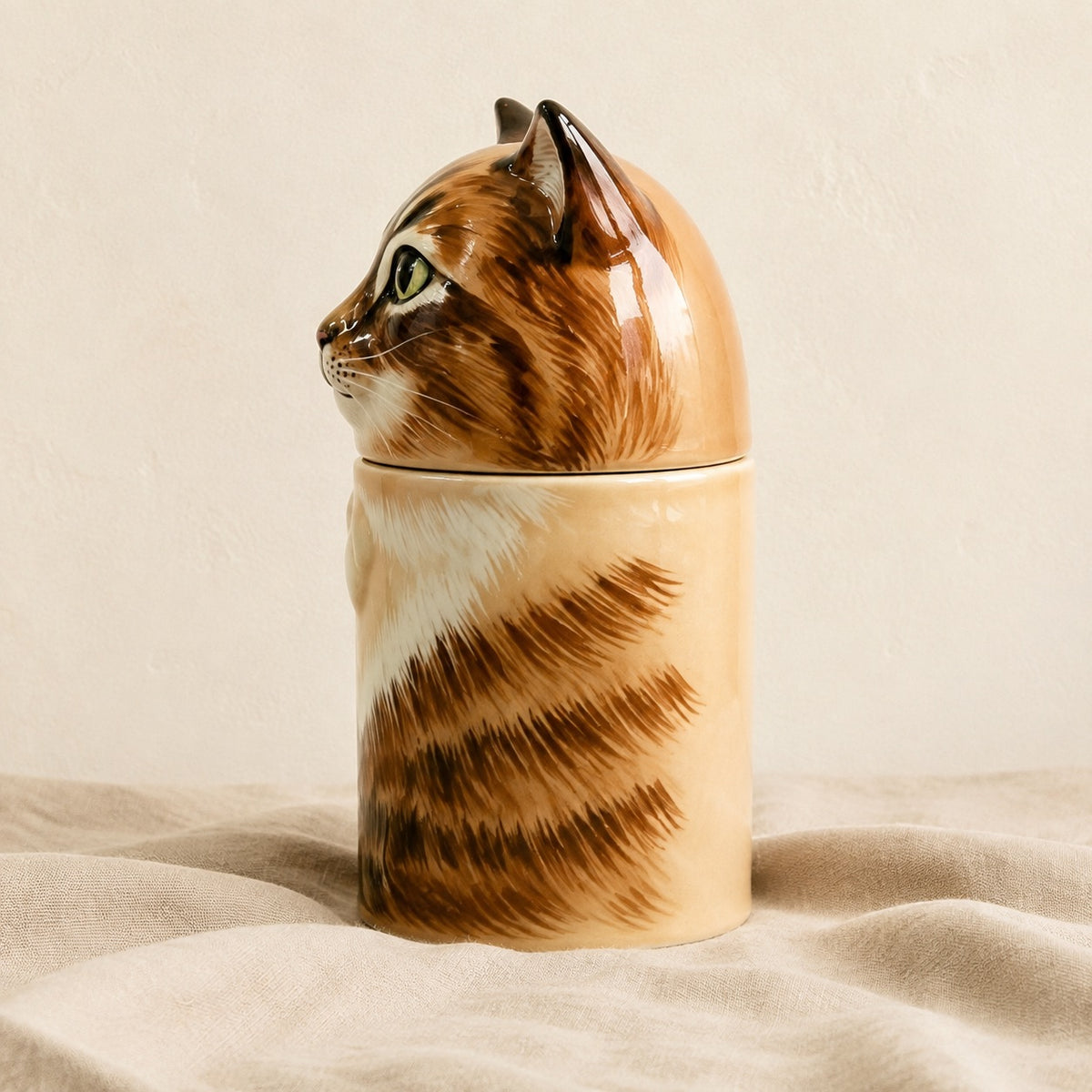 Left side view of a large ceramic tabby cat memorial urn