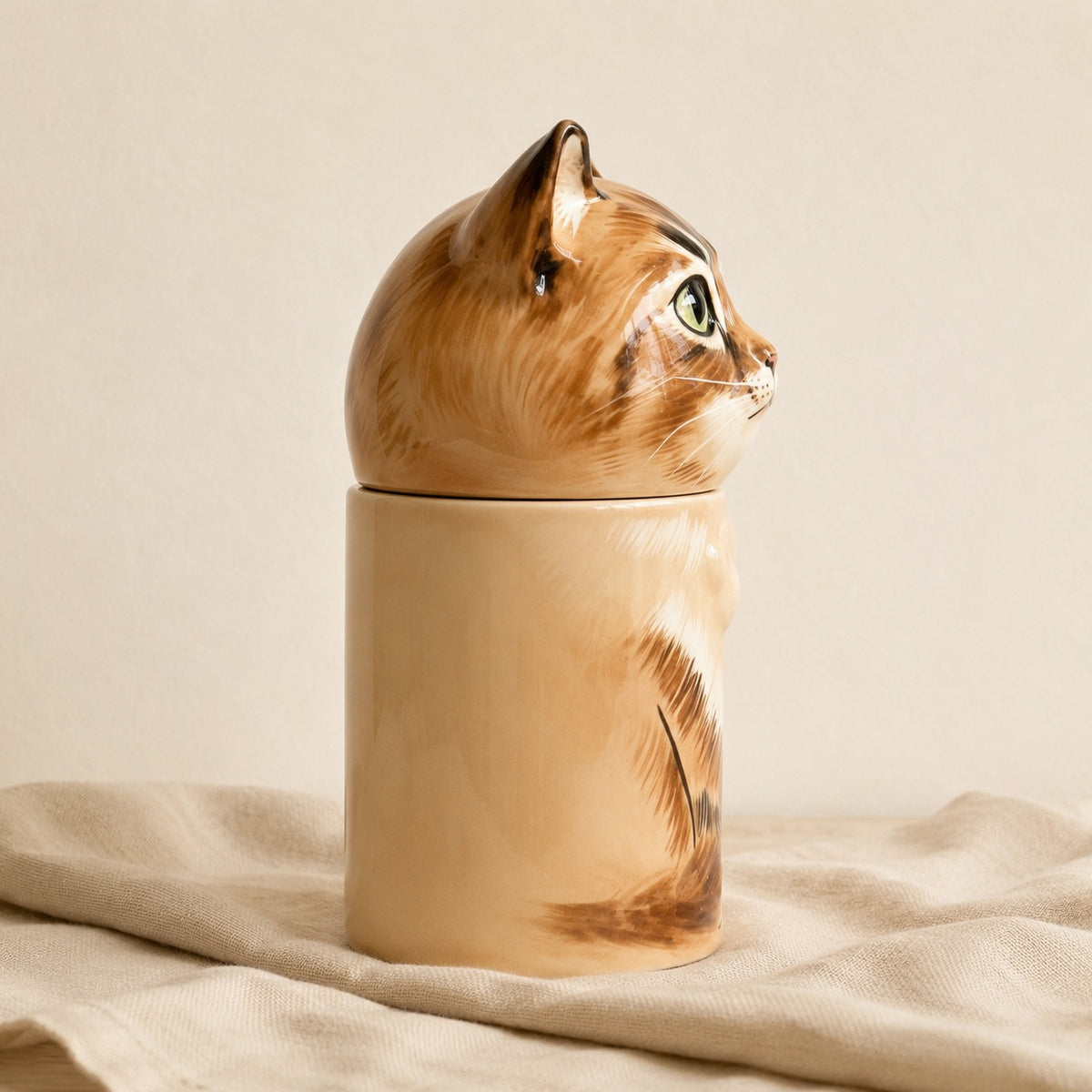 Right side view of a large ceramic tabby cat memorial urn