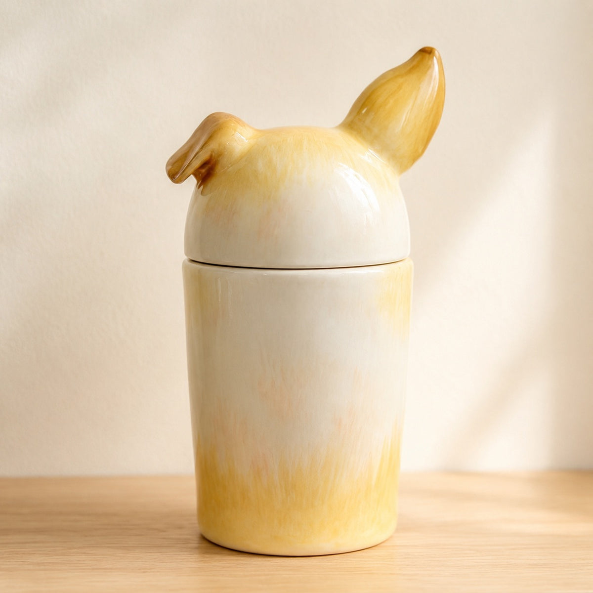 Rear view of a hand-painted ceramic Corgi urn for ashes