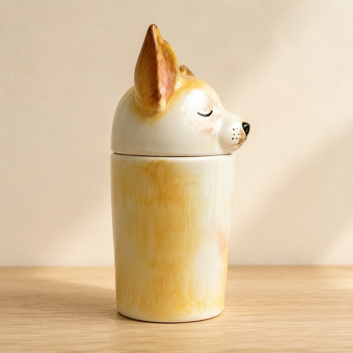 Side profile of a personalized ceramic Corgi memorial urn facing right